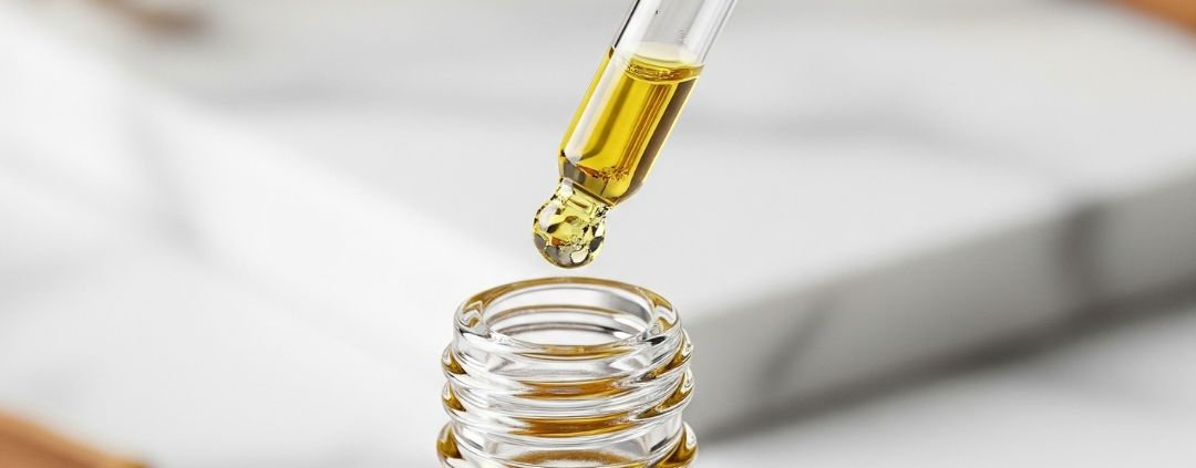 Dropper with golden licorice root serum, a gentle ingredient for skin brightening.